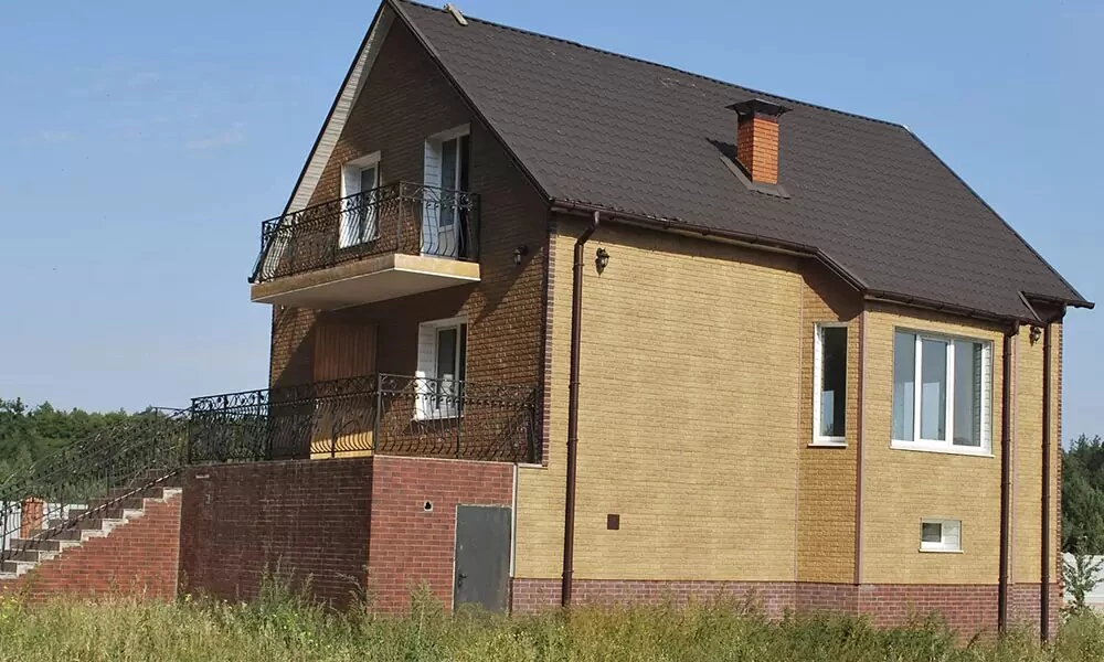 Фасадні панелі під камінь