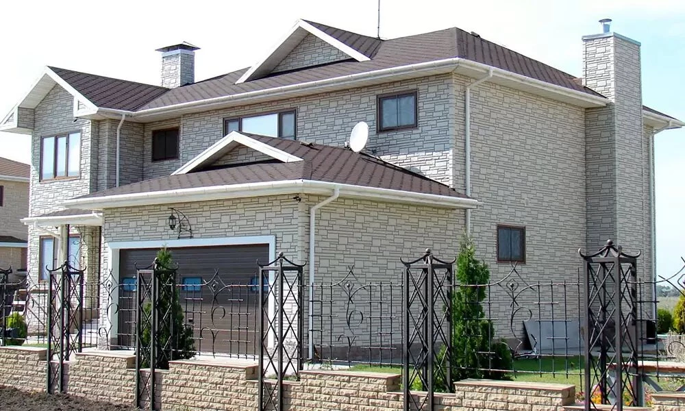 Фасадні панелі під камінь