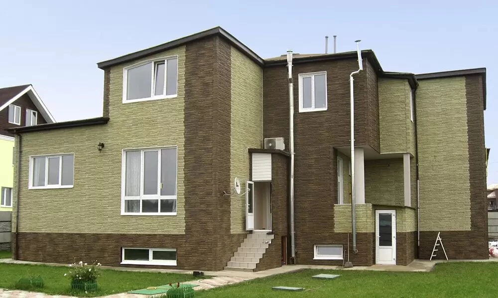 Фасадні панелі під камінь