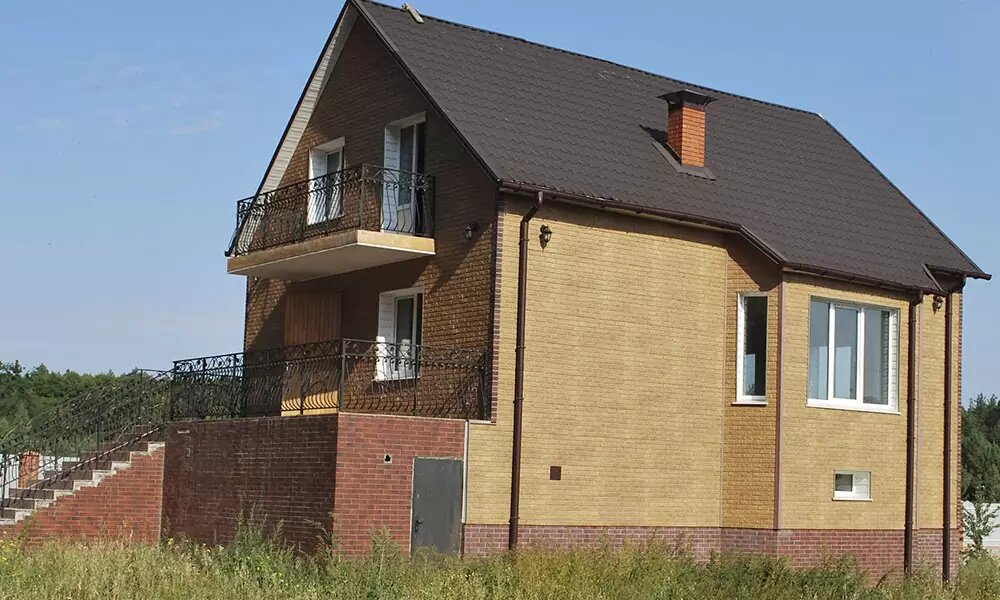 Фасадні панелі під камінь