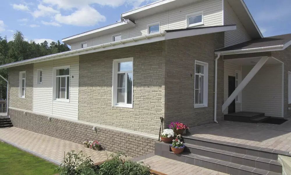 Фасадні панелі під камінь